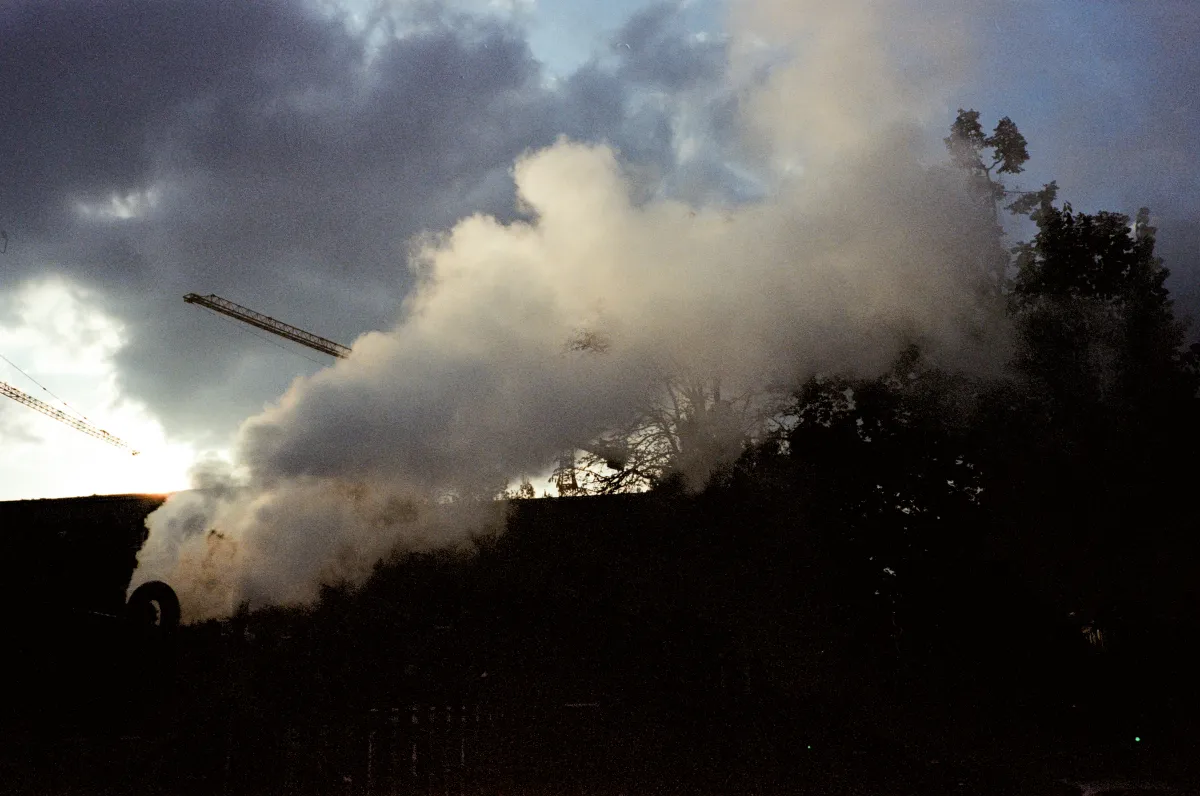 Smoke rising against a dark sky
